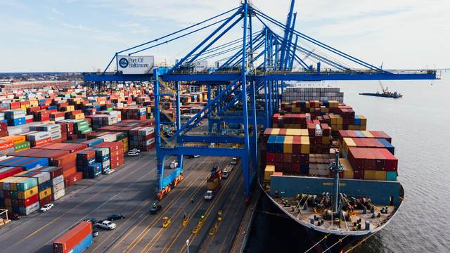 Container ship being loaded at port